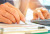 businessmen-are-using-a-calculator-and-using-a-PKU2PEL1 (1)