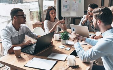 Young professional team. Top view of young modern people in smar
