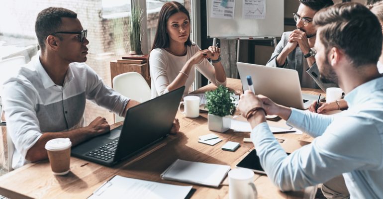 Young professional team. Top view of young modern people in smar