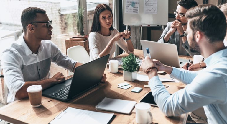Young professional team. Top view of young modern people in smar