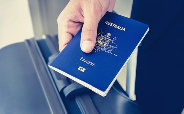 Hands giving passport (of Australia)
